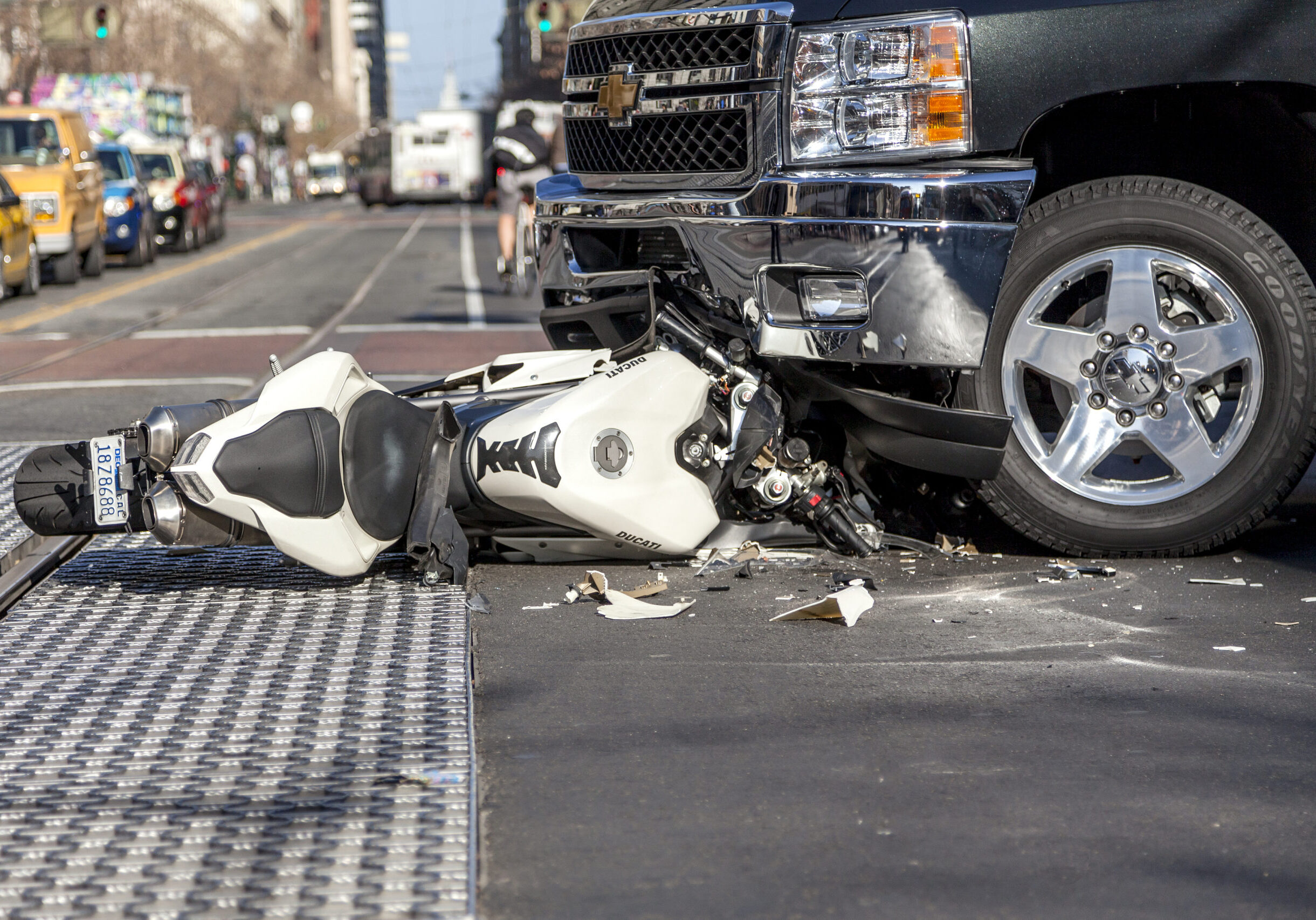 San Francisco, USA - January 23, 2014: A bad traffic accident between a white Ducati motorcycle and Chevy pickup truck occurred on Market street in the late afternoon and brought traffic to a halt, backing up Muni buses and light rain trains. No fatalities were reported.
